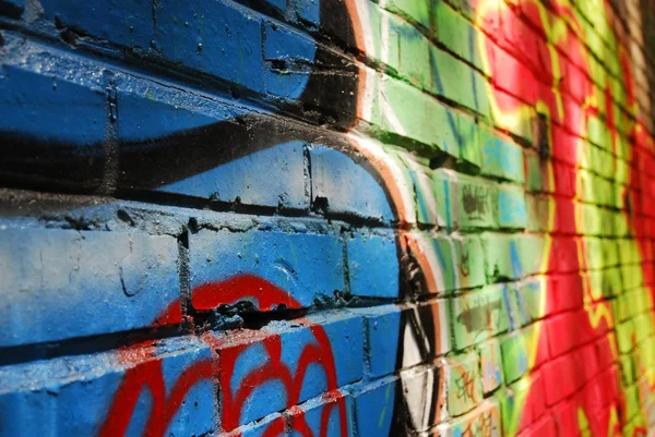 Close-up of graffiti brick wall — Stock Photo, Image