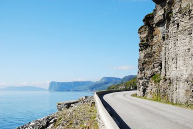 Summer road along the coast of Mageroya. clipart