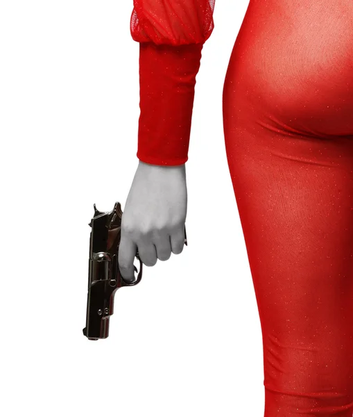 Vrouwelijke hand met pistool en sexy dij in het rood — Stockfoto