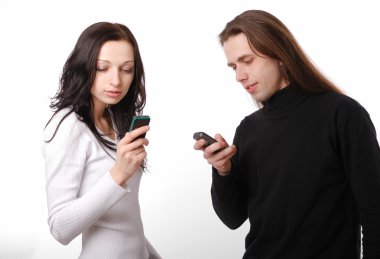 Young couple texting by phone clipart