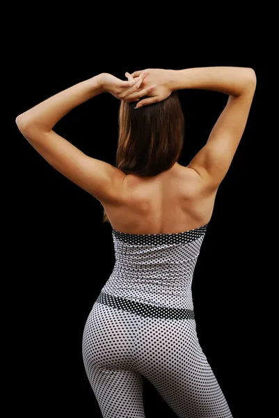 Young woman in the bodysuit from back — Stock Photo, Image