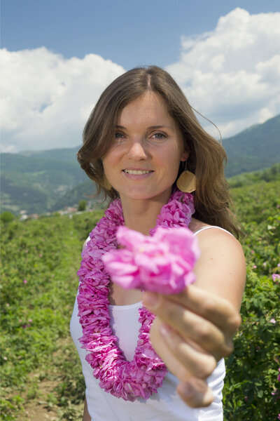 Beautiful girl offering a rose