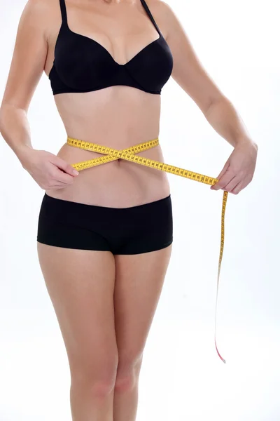 Woman measuring her waistband — Stock Photo, Image