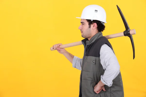Profile of man with pick-axe — Stock Photo, Image