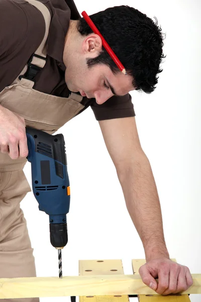 Craftsman making a hole with a drill — Stock Photo, Image