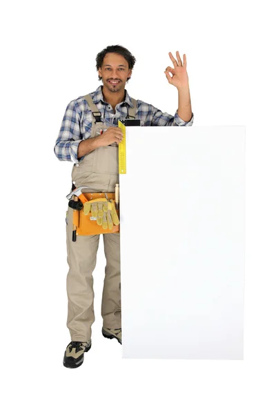 Carpenter thinks measurements are OK — Stock Photo, Image
