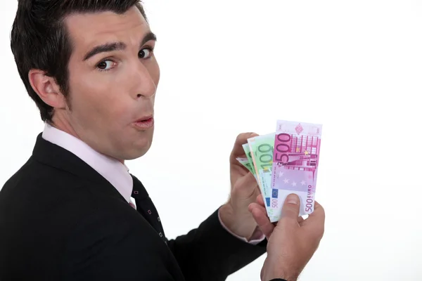 Rich businessman showing off his money — Stock Photo, Image
