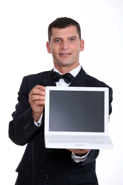 stock image Man presenting laptop