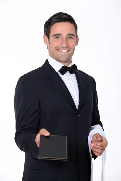 Waiter with a menu — Stock Photo, Image