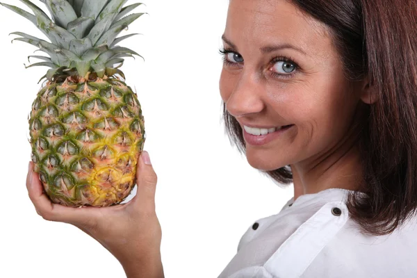 stock image Woman holding fresh pineapple