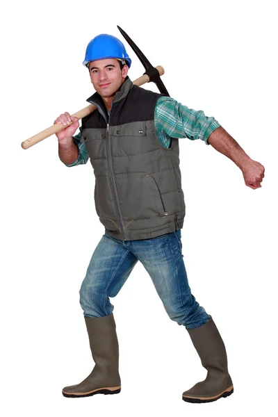 Worker with a pickaxe — Stock Photo, Image