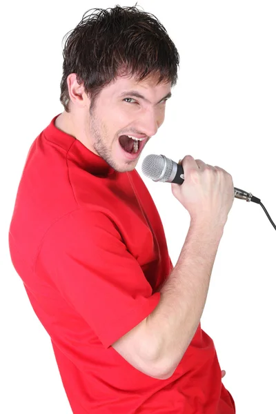 Homem cantando no microfone — Fotografia de Stock