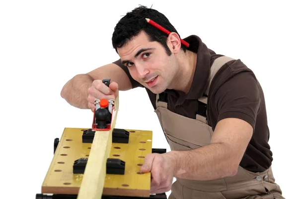 A carpenter with a plane. — Stock Photo, Image