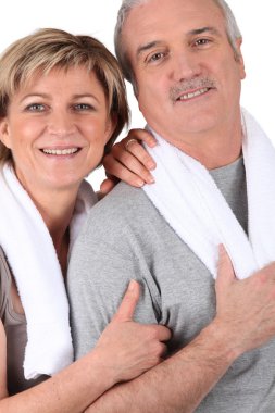 Mature couple resting after fitness clipart