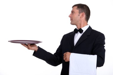 A waiter holding an empty tray clipart