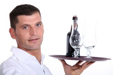 Waiter serving a bottle of beer clipart