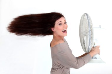 Brunette stood in front of fan clipart