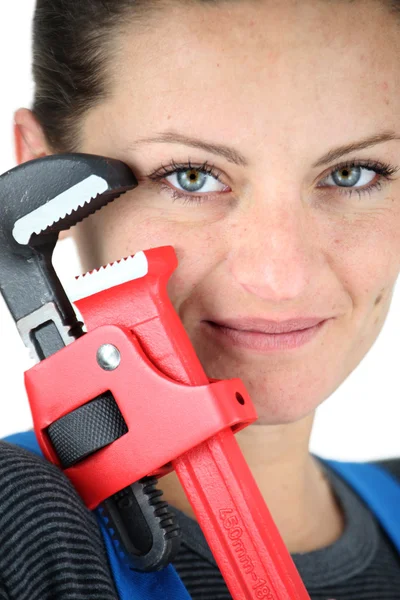Woman holding adjustable wrench — Stock Photo, Image