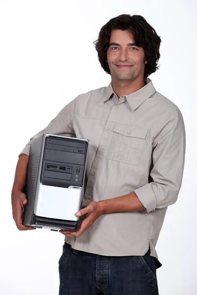 Man holding a computer tower — Stock Photo, Image