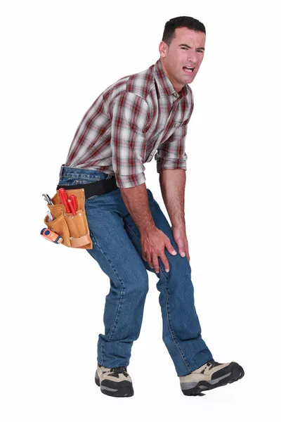 Craftsman with pain in the knee — Stock Photo, Image