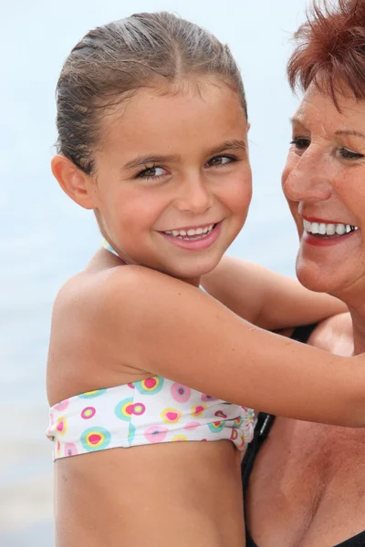 Grandmother with child in her arms — Stock Photo, Image