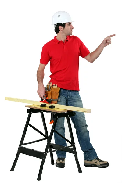 Carpenter pointing to empty copyspace — Stock Photo, Image