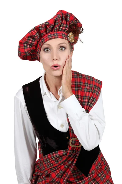 Vrouw in Schotse kostuum — Stockfoto