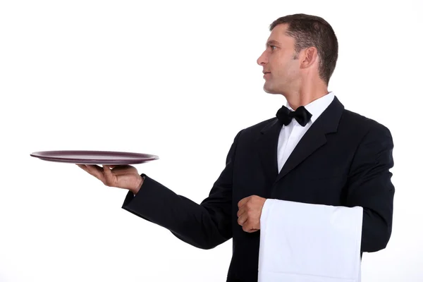 Σερβιτόρος κρατώντας ένα κενό δίσκο — Φωτογραφία Αρχείου