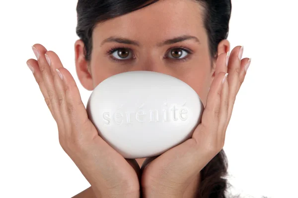 Female holding a bar of soap — Stock Photo, Image