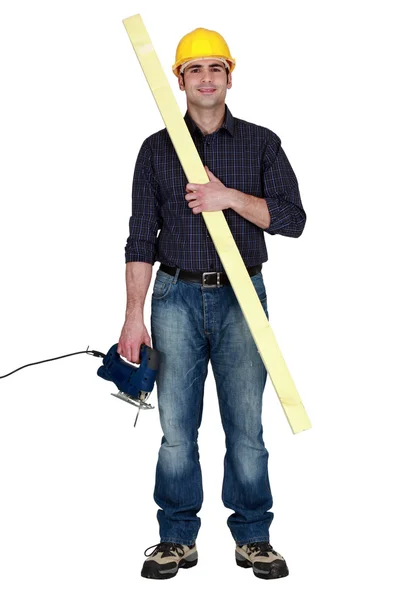 Carpenter using his electric drill — Stock Photo, Image