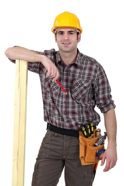 Carpenter about to mark wood with pencil — Stock Photo, Image