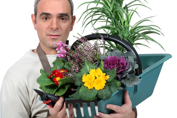 Um florista com sua criação — Fotografia de Stock