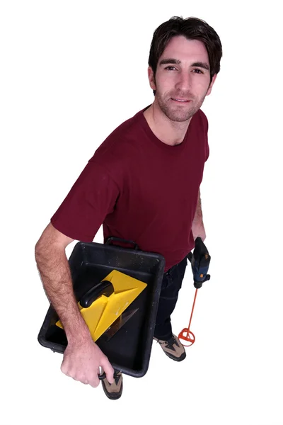 Man carrying pain mixing equipment — Stock Photo, Image