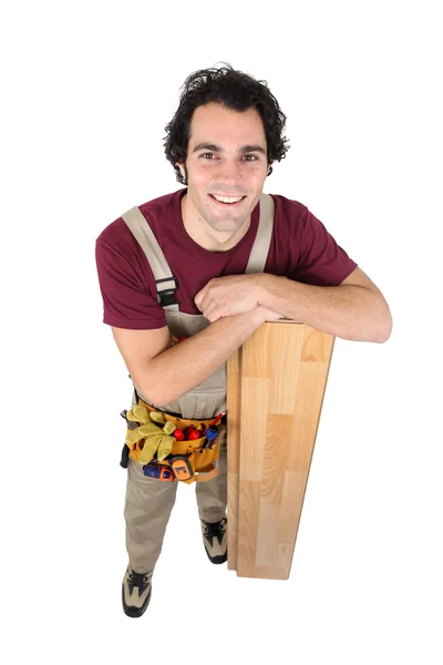 Працівник з дерев'яними підлогами — стокове фото