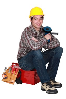 Mason sitting on toolbox clipart