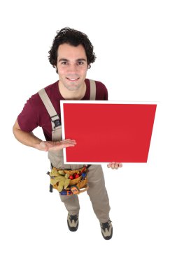 Handyman gesturing towards blank poster clipart