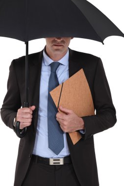 Businessman under an umbrella clipart