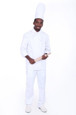 Happy male chef holding rolling pin clipart