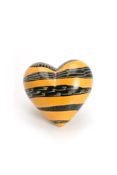 Black and yellow heart-shaped object — Stock Photo, Image