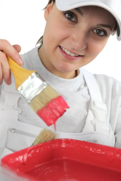 Female decorator with red paint — Stock Photo, Image