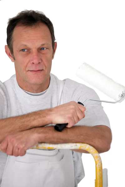 Decorator stood with paint roller — Stock Photo, Image