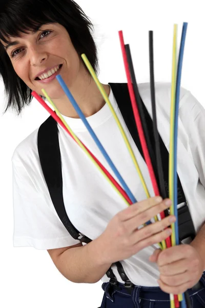 Woman holding pipe cleaners — Stock Photo, Image