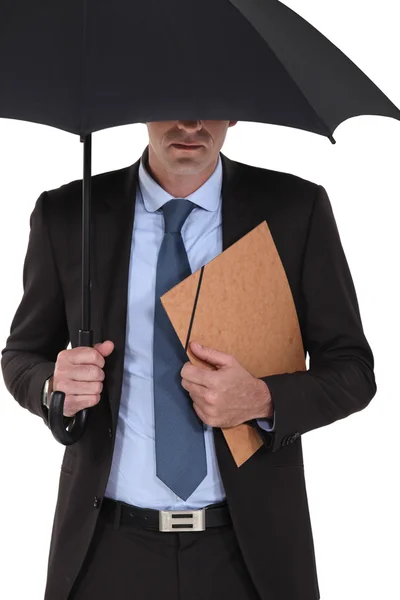 Zakenman onder een paraplu — Stockfoto