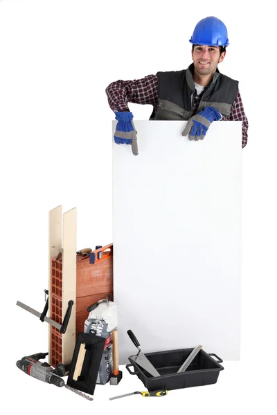 Samozatrudniony murarz reklamujący swoje usługi — Zdjęcie stockowe