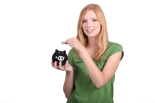 Portrait of a young woman with money box — Stock Photo, Image