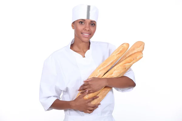 Ženské baker s bagetou — Stock fotografie
