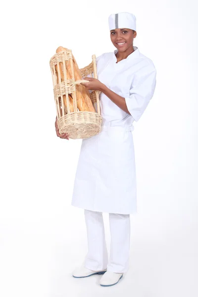 A baker showing off her bread — Stock Photo, Image