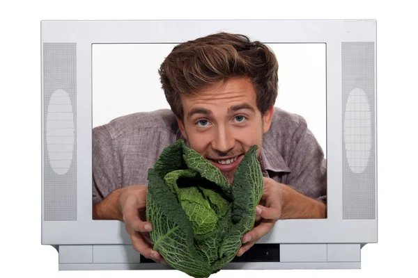 Man presenting cabbage — Stock Photo, Image