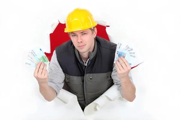 Arrogant builder flashing cash — Stock Photo, Image