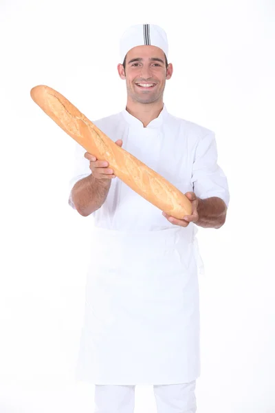 A baker showing off his bread — Stock Photo, Image